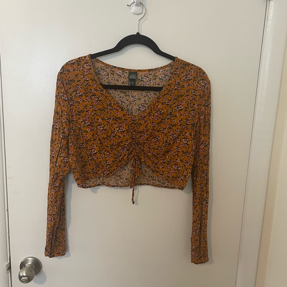 Medium long sleeve crop top, rusty orange color, looser fit, great condition